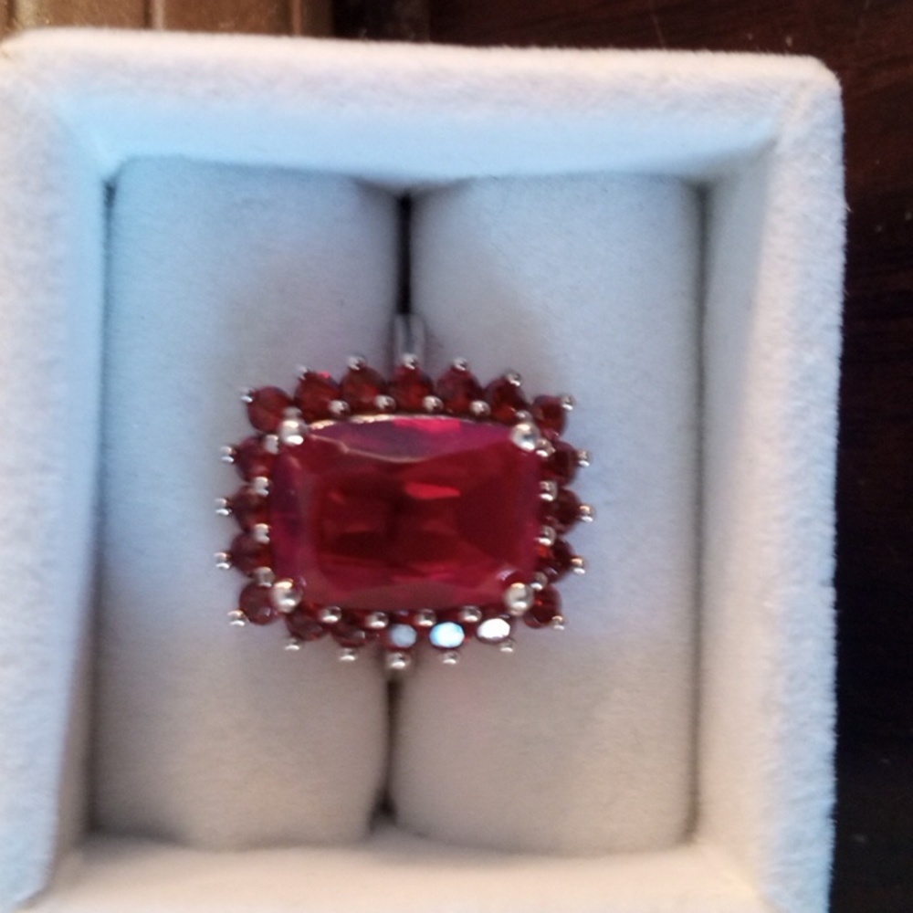 6 carat cushion cut Ruby surrounded by Sun burst colored garnets set in 925 S.S